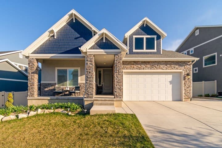 A new single-family home with a front lawn