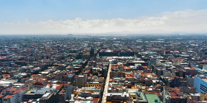 Aerial view across a dense city